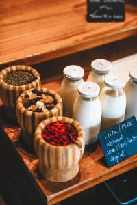 a group of jars and bowls of spices on a shelf at Aldeia da Cuada in Faja Grande