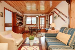 a living room with a couch and a table at Saliecho by Cardi Suites in Sallent de Gállego