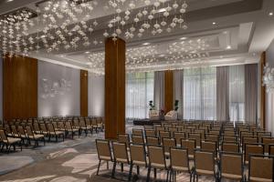 an empty hall with rows of chairs and a chandelier at The Westin New York Grand Central in New York