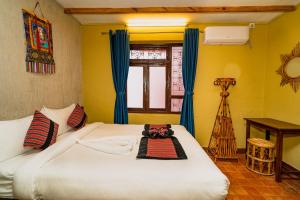 Letto o letti in una camera di Thamel Heritage Hostel