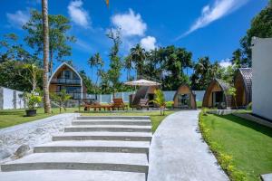 dom z kamienną ścieżką prowadzącą do domu w obiekcie Linasi Resort Sri Lanka w mieście Ahangama