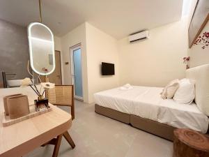 Postel nebo postele na pokoji v ubytování ONE18 Boutique Hotel