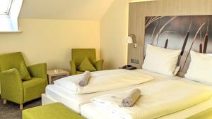 Postel nebo postele na pokoji v ubytování Hotel Gierer