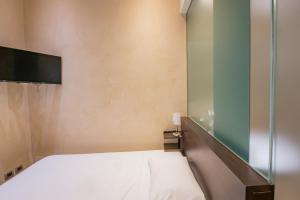 Postel nebo postele na pokoji v ubytování Century Hotel