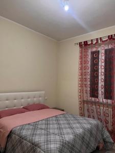 Postel nebo postele na pokoji v ubytování Edi Apartments