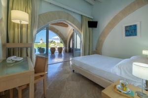 Postel nebo postele na pokoji v ubytování Resort I Mulini + 37 fotografií