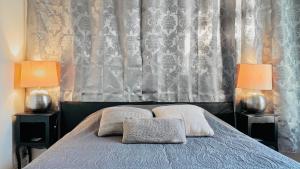 Cama o camas de una habitación en Chambre calme vue jardin