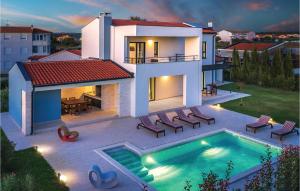 a house with a swimming pool in the backyard at Amazing Home In Valbandon in Fondole +51 photos