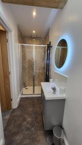 a bathroom with a shower and a sink at Pear Tree Barns in Rangeworthy +67 photos