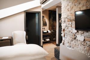 TV o dispositivi per l'intrattenimento presso Boutiquehotel Weisses Rössl