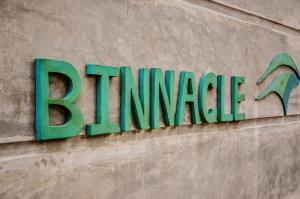 a sign on the side of a building at Binnacle Negombo in Negombo