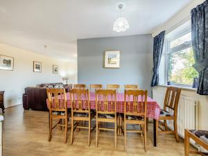 a dining room with a table and chairs at Heritage Wharf in Mow Cop
