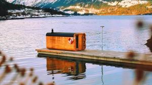 a radio sitting on a dock on a lake at Yttervik in Mo i Rana