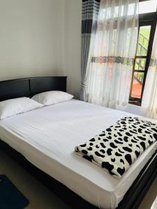 Letto o letti in una camera di Mystik Muthu View Resort