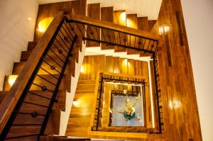 a spiral staircase with a mirror in a room at Binnacle Negombo in Negombo