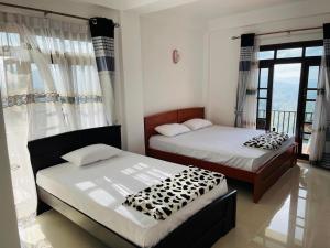 Letto o letti in una camera di Mystik Muthu View Resort