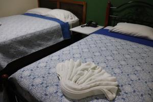 Krevet ili kreveti u jedinici u objektu Hotel Toledo