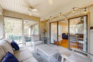 a living room with a couch and a table at Inlet Cove 11 in Kiawah Island