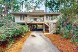 a large house with a porch and a walk way to it at Inlet Cove 11 in Kiawah Island