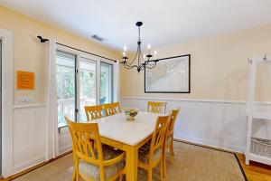 a dining room with a table and chairs at Inlet Cove 11 in Kiawah Island