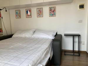 a bedroom with a bed and a side table at Monolocale con ampio terrazzo in Milan
