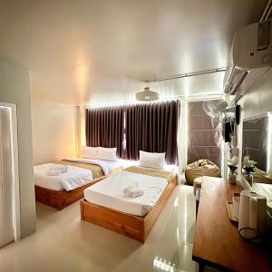 Postel nebo postele na pokoji v ubytování Yoi Hotel krabi