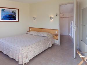 Postel nebo postele na pokoji v ubytování Logis Hôtel le Clos du Vigneron