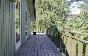 a porch of a house with a wooden deck at Three-Bedroom Holiday Home In Knebel in Knebel