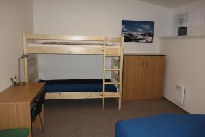 Posteľ alebo postele v izbe v ubytovaní Apartman Flora