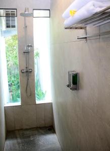 Et badeværelse på Delu Villas & Suite