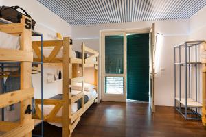 Postel nebo postele na pokoji v ubytování Gabanel Bike Hostel