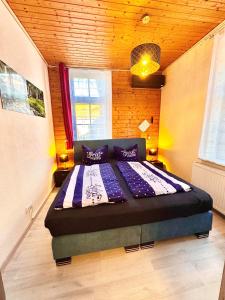 Ένα ή περισσότερα κρεβάτια σε δωμάτιο στο Ferienhaus Zur Abzuchtinsel