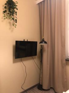 TV a/nebo společenská místnost v ubytování Sands Chrobrego Pokoje