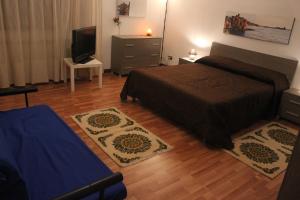 A bed or beds in a room at La Casetta