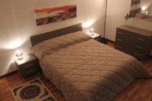 A bed or beds in a room at La Casetta
