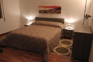 A bed or beds in a room at La Casetta