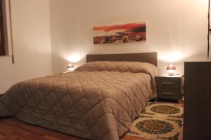 A bed or beds in a room at La Casetta