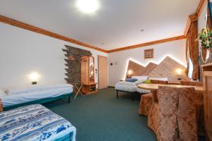 Postel nebo postele na pokoji v ubytování Hotel Ciamol