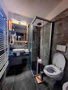 Koupelna v ubytování Hotel Ciamol