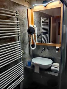 Koupelna v ubytování Hotel Ciamol
