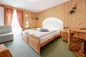 Postel nebo postele na pokoji v ubytování Hotel Ciamol