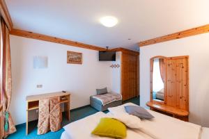Postel nebo postele na pokoji v ubytování Hotel Ciamol