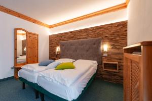Postel nebo postele na pokoji v ubytování Hotel Ciamol