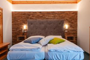 Postel nebo postele na pokoji v ubytování Hotel Ciamol