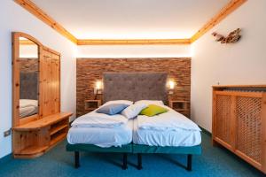 Postel nebo postele na pokoji v ubytování Hotel Ciamol