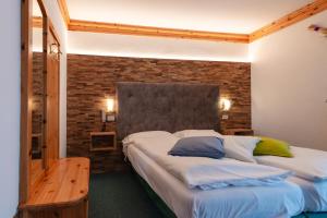 Postel nebo postele na pokoji v ubytování Hotel Ciamol