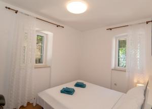 Postel nebo postele na pokoji v ubytování Apartments Srdanovic