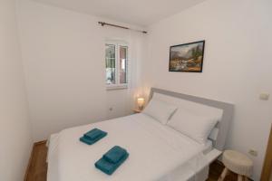 Postel nebo postele na pokoji v ubytování Apartments Srdanovic