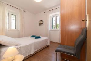 Postel nebo postele na pokoji v ubytování Apartments Srdanovic