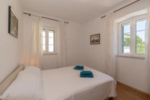 Postel nebo postele na pokoji v ubytování Apartments Srdanovic